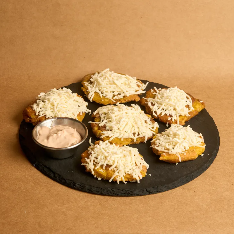 Tostones de patata fritos dos veces, dorados y crujientes Tronco Grill
